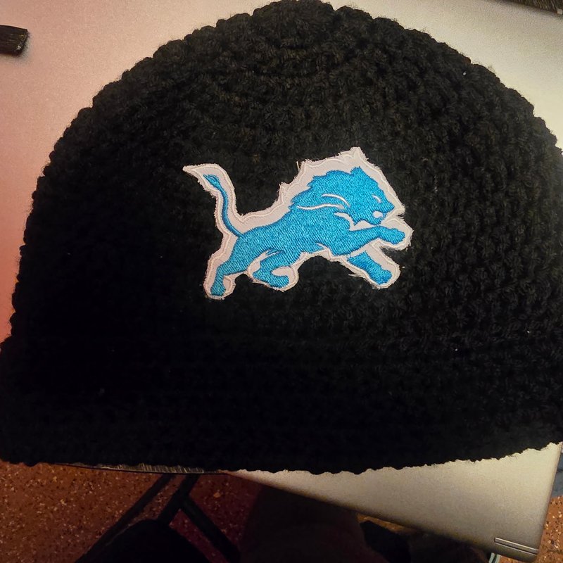 Black crochet beanie with Detroit Lions logo patch