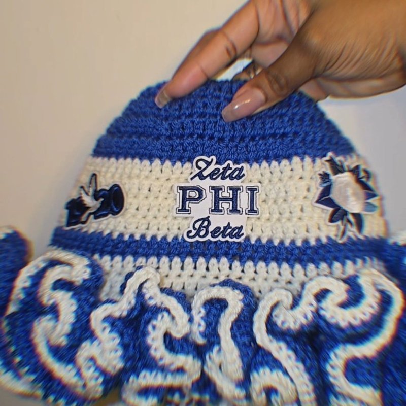 Custom crochet bucket hat with Zeta Phi Beta lettering and crest patches